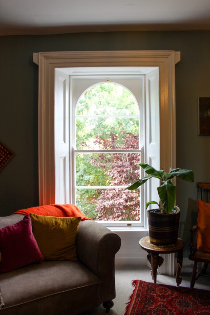refurbished arched window with vacuum glazing